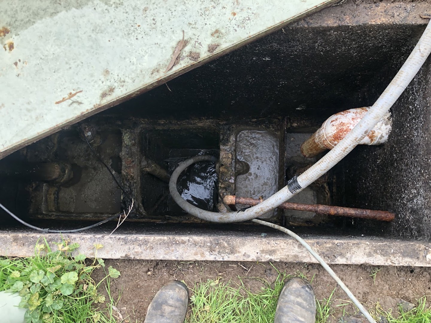 A jetting hose fed into an in-ground inspection chamber at a Ballarat house