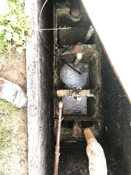 Looking down into an opened access void at the drain line beneath a Ballarat house