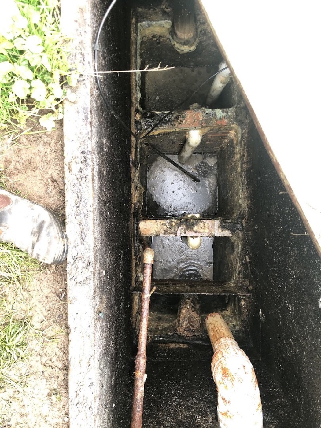 Looking down into an opened access void at the drain line beneath a Ballarat house